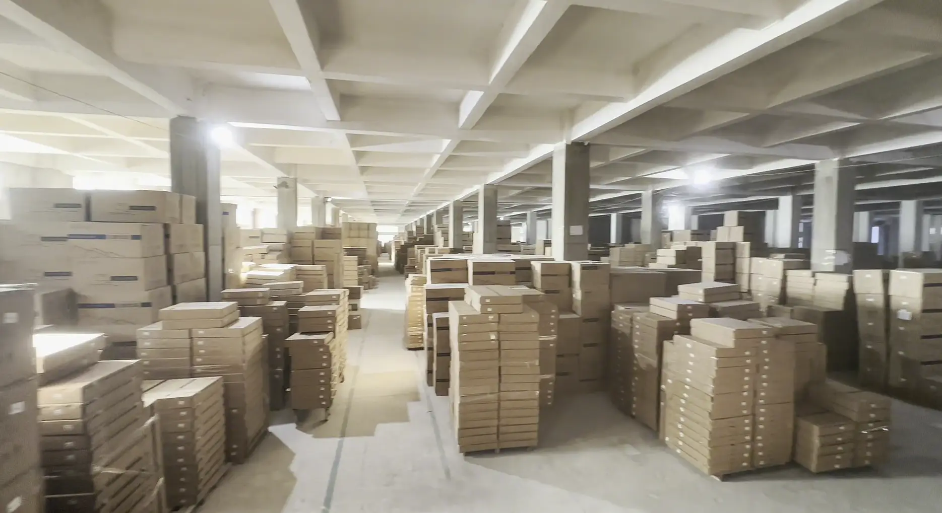 Packaged cabinets stacked in warehouse