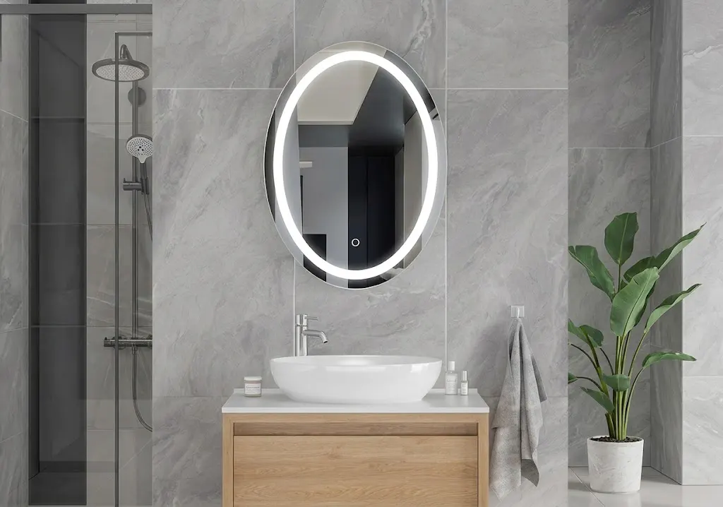 Oval front-lit LED bathroom mirror above a vanity